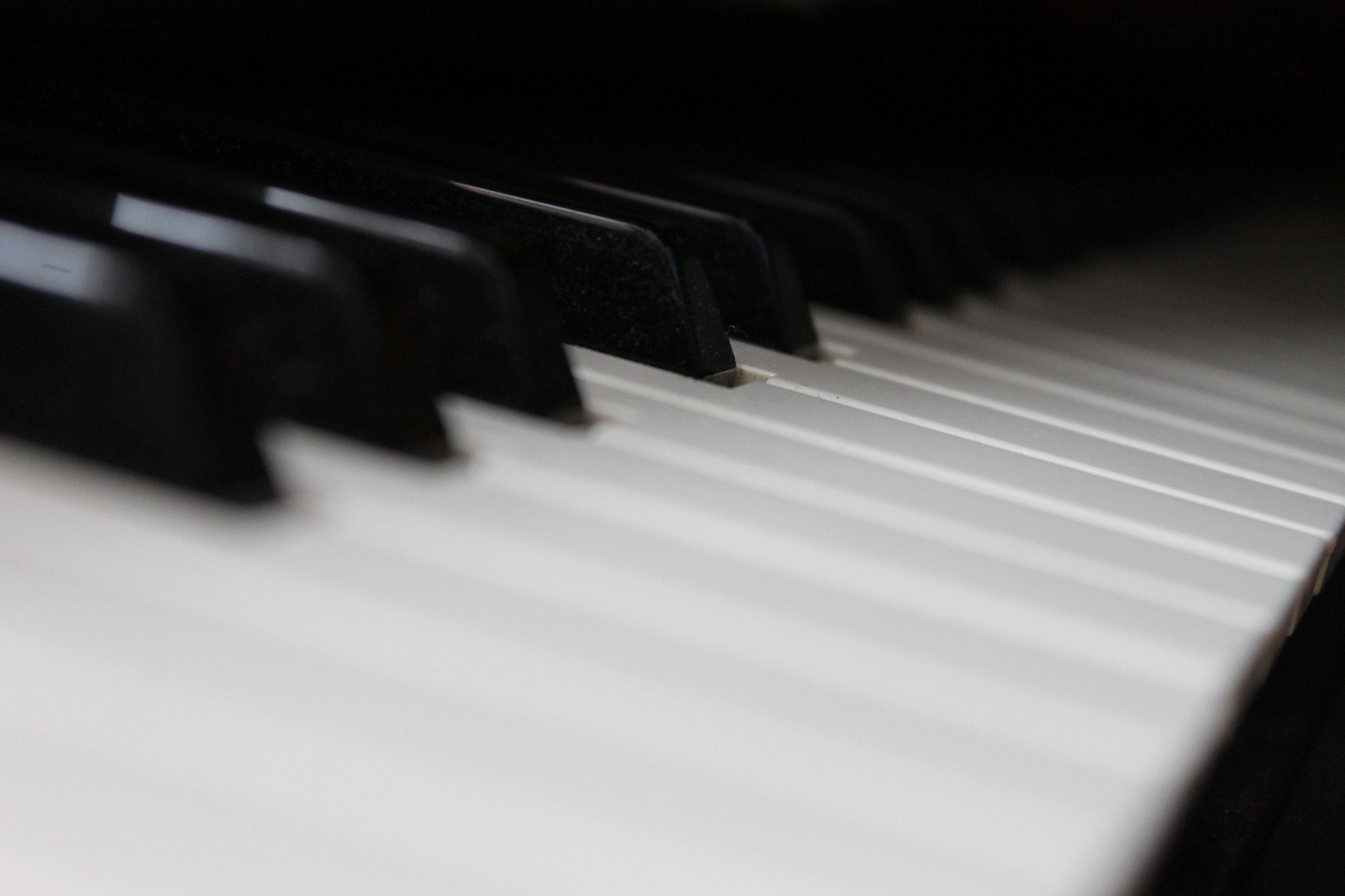 Close view of the black and white keys of a piano